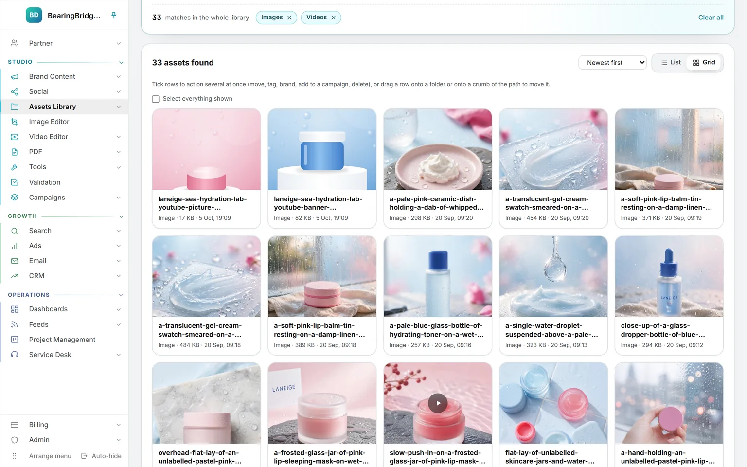 The whole library filtered to images and videos, 31 of them, as a grid of generated product pictures and one clip, each card showing its name, size, and date